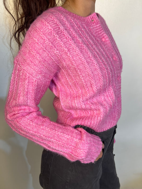 Girl wearing tailored cactus pink knit cardigan