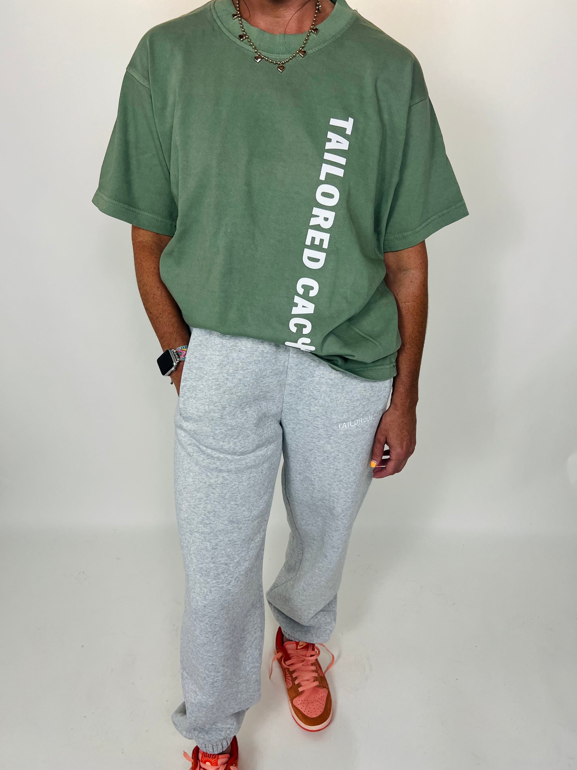 Tailored cactus girl in green shirt and grey sweat pants 