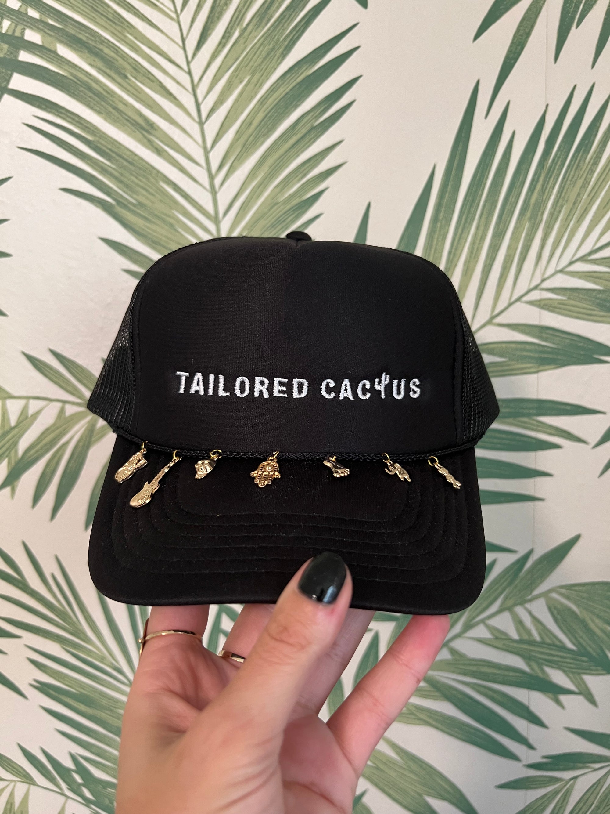 Black tailored cactus trucker hat with charms 