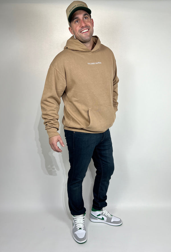 Guy wearing tan tailored cactus hoodie 