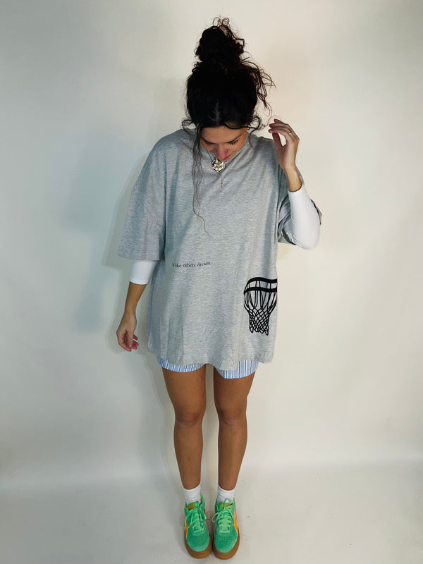 Tailored cactus girl in grey tee shirt with live like other dream and basketball hoop