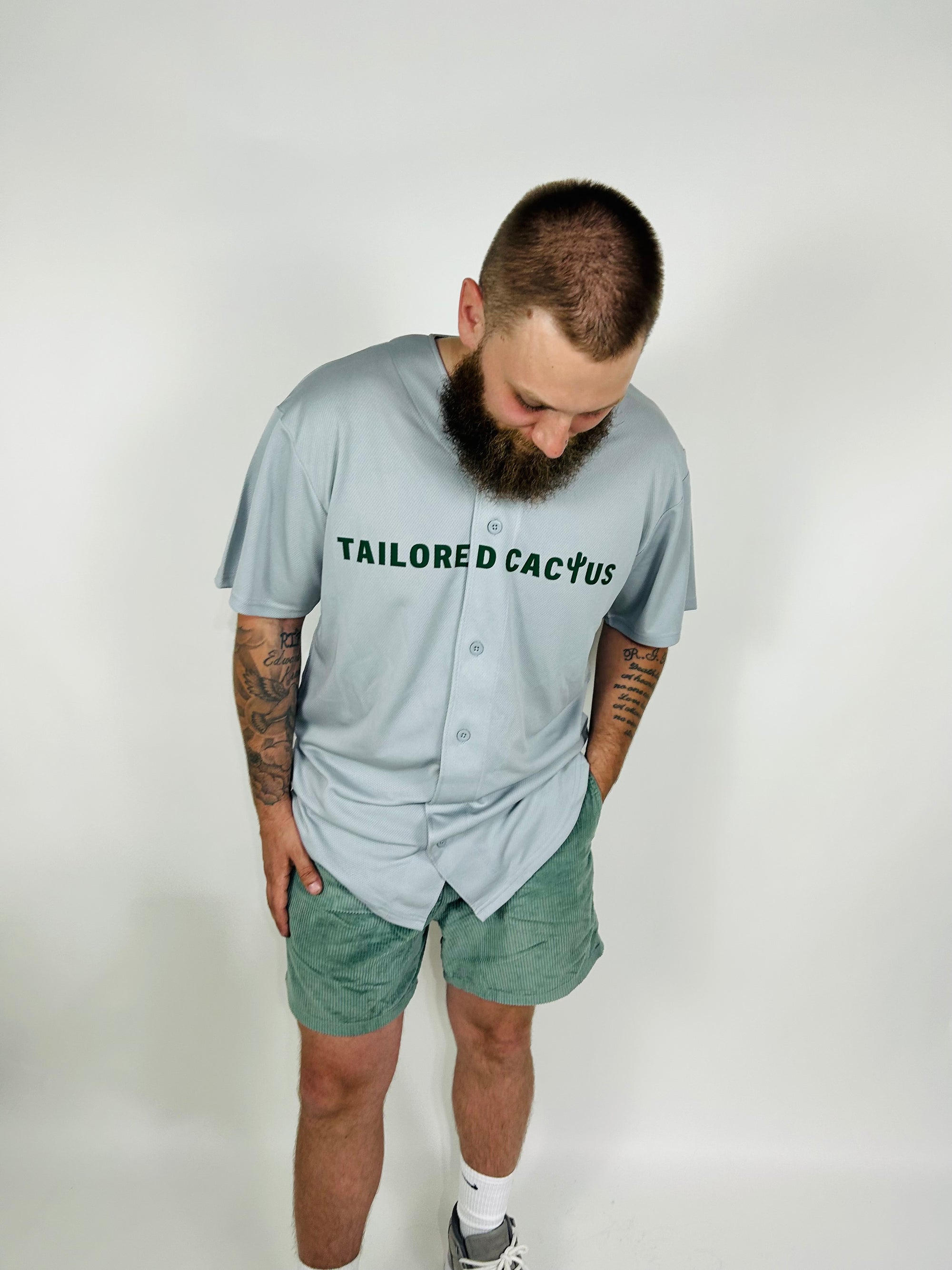 Man in grey tailored cactus baseball jersey 