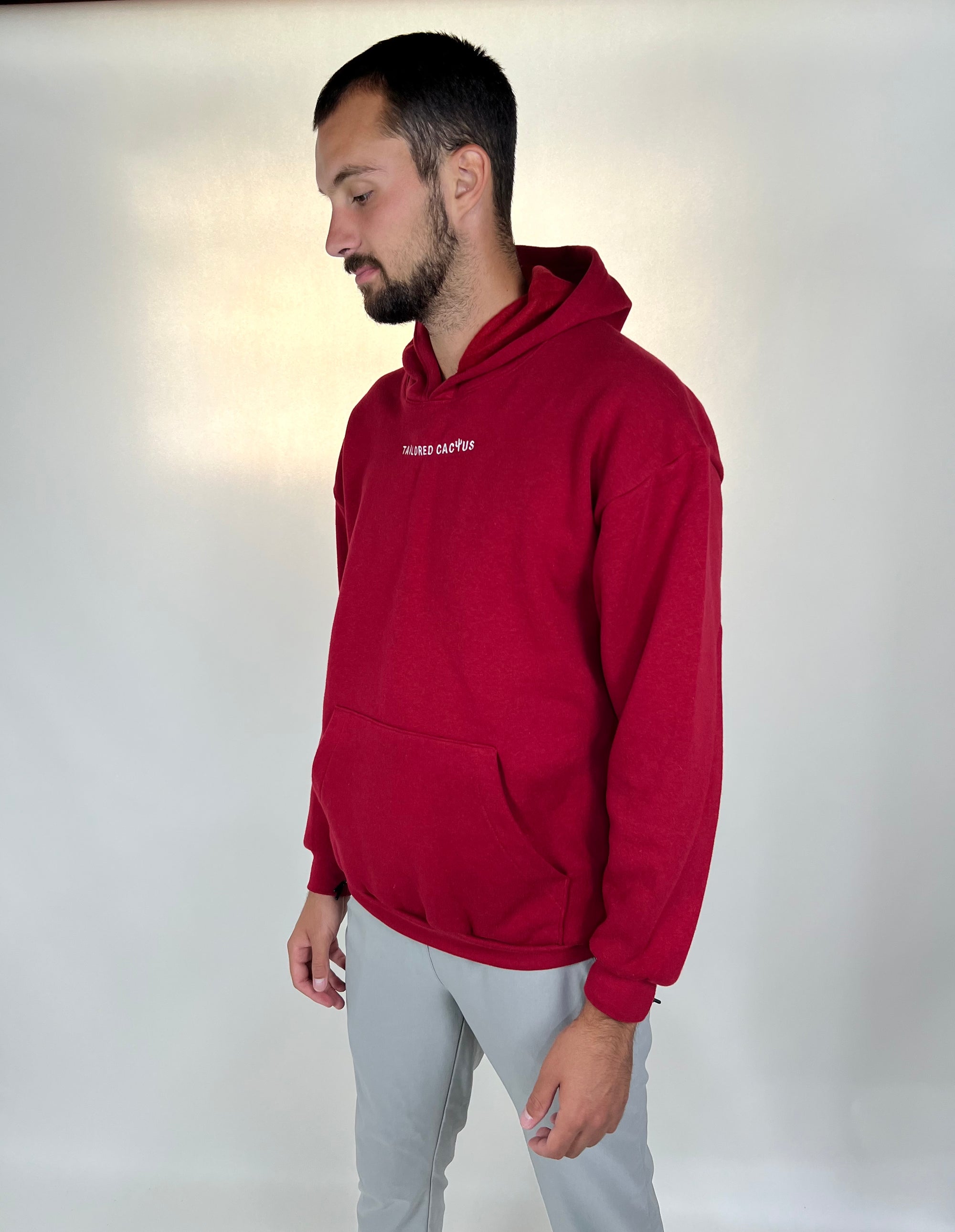 Man in tailored cactus red hoodie 