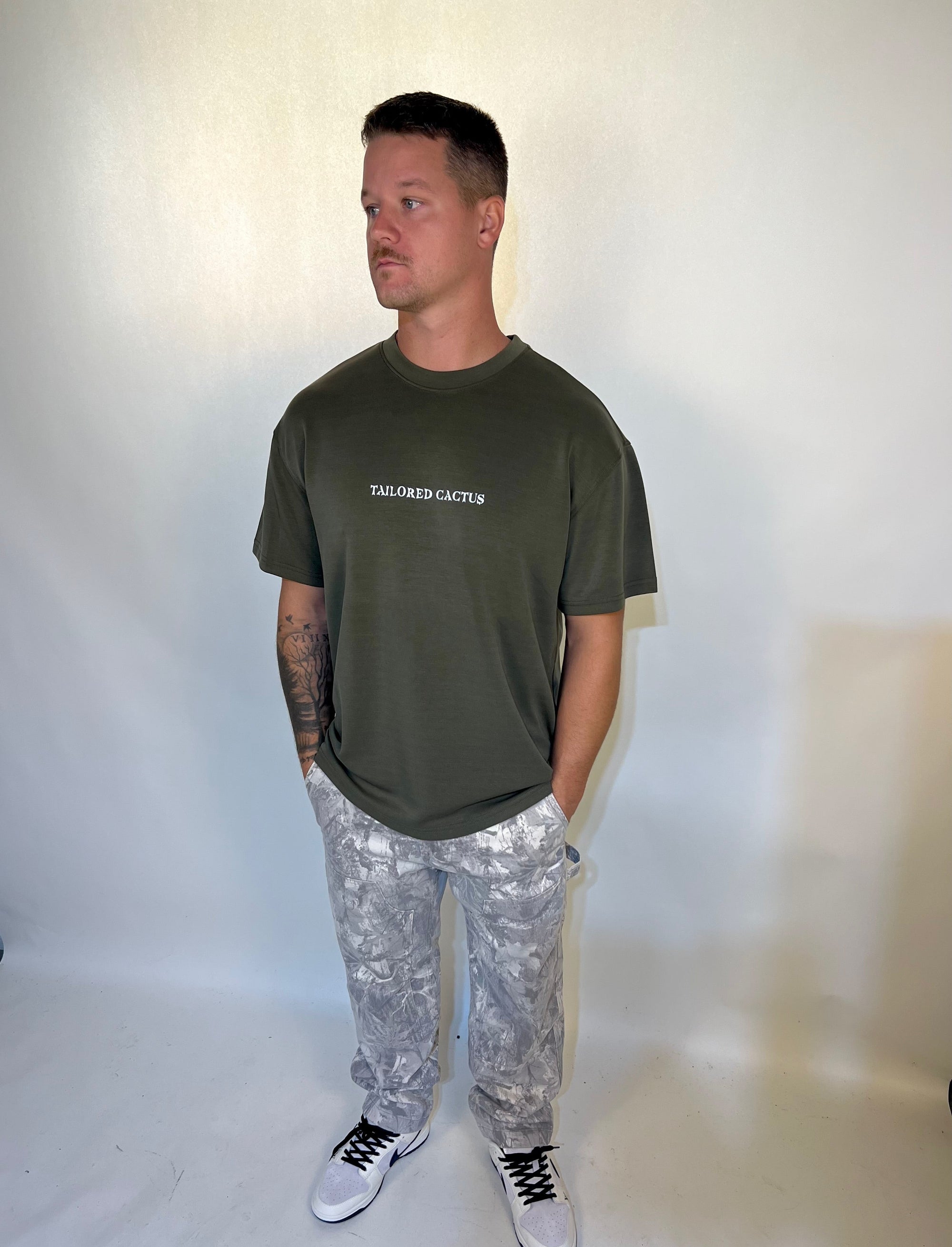 Man in tailored cactus army green T shirt 