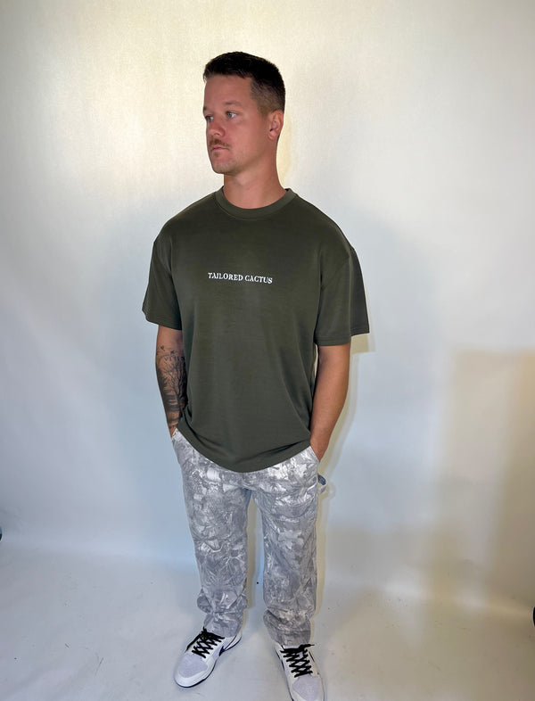 Man in tailored cactus army green T shirt 