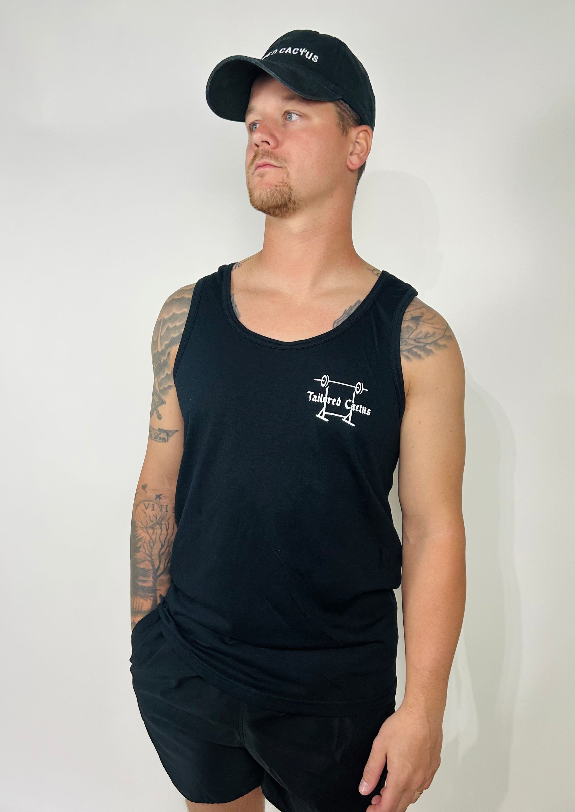 Tailored cactus man in black workout tank top 