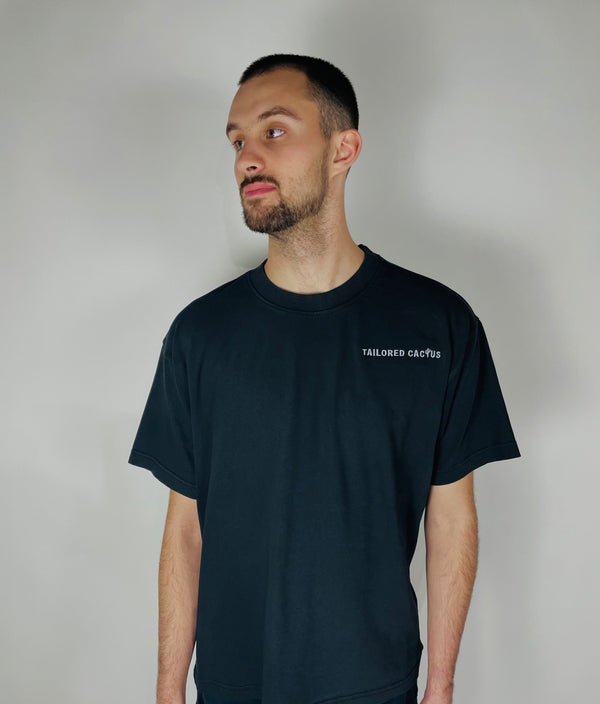 Tailored Cactus guy in black tee with tailored cactus on front 