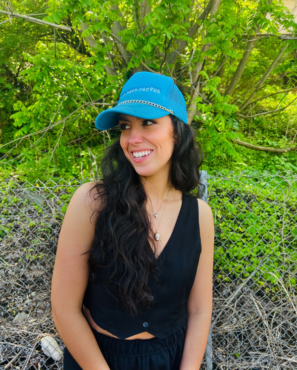 Tailored cactus girl in chain trucker hat 
