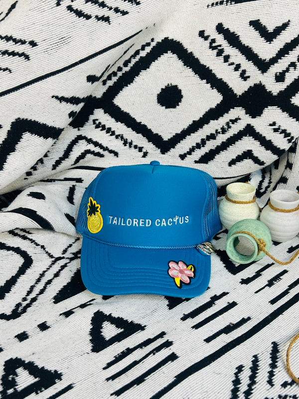 Tailored cactus blue trucker hat with seashell charms 