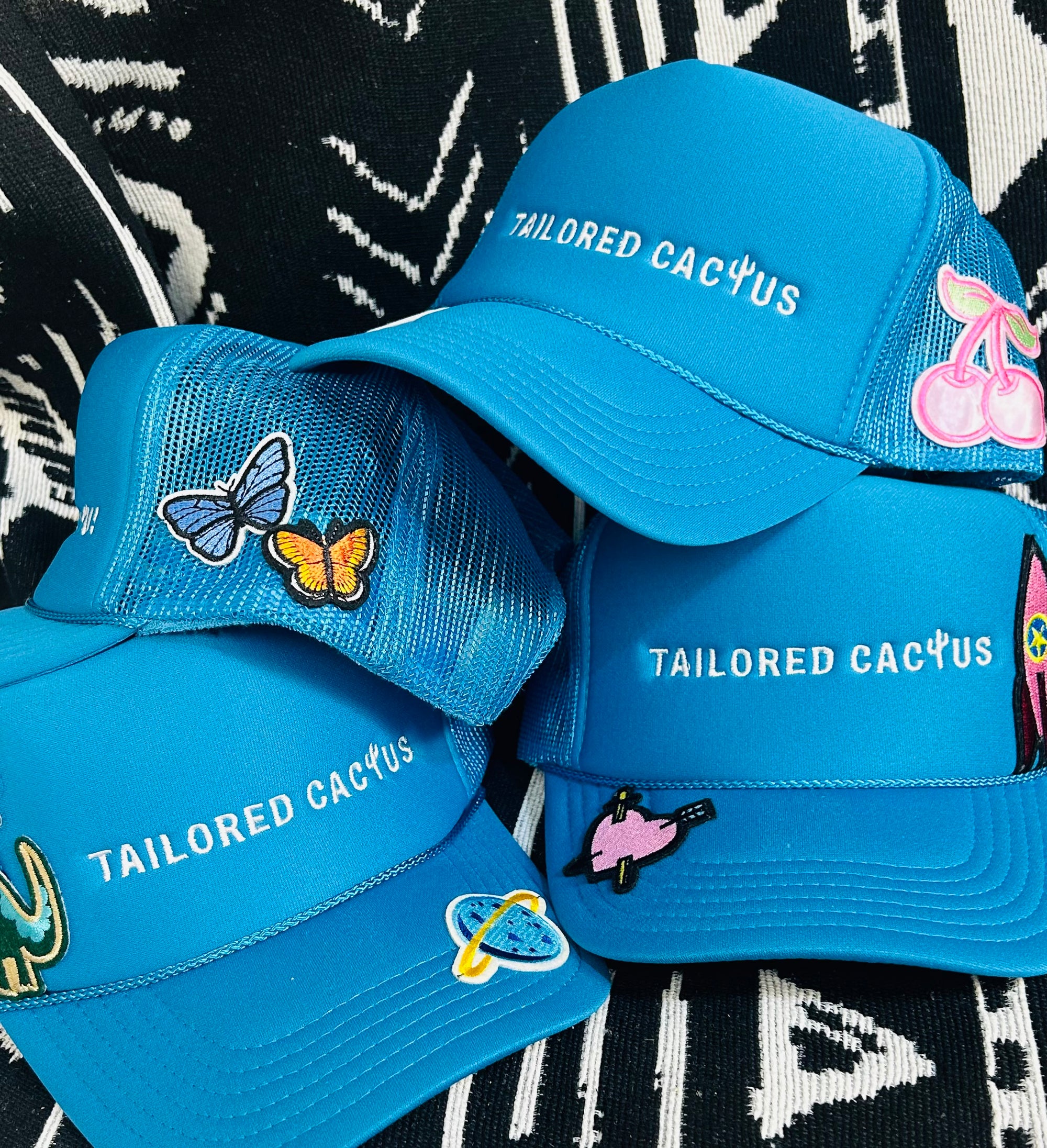 Tailored cactus trucker hats with patches in blue 