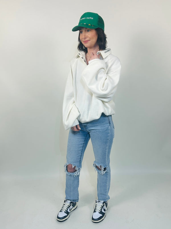 Girl in tailored cactus white half button top