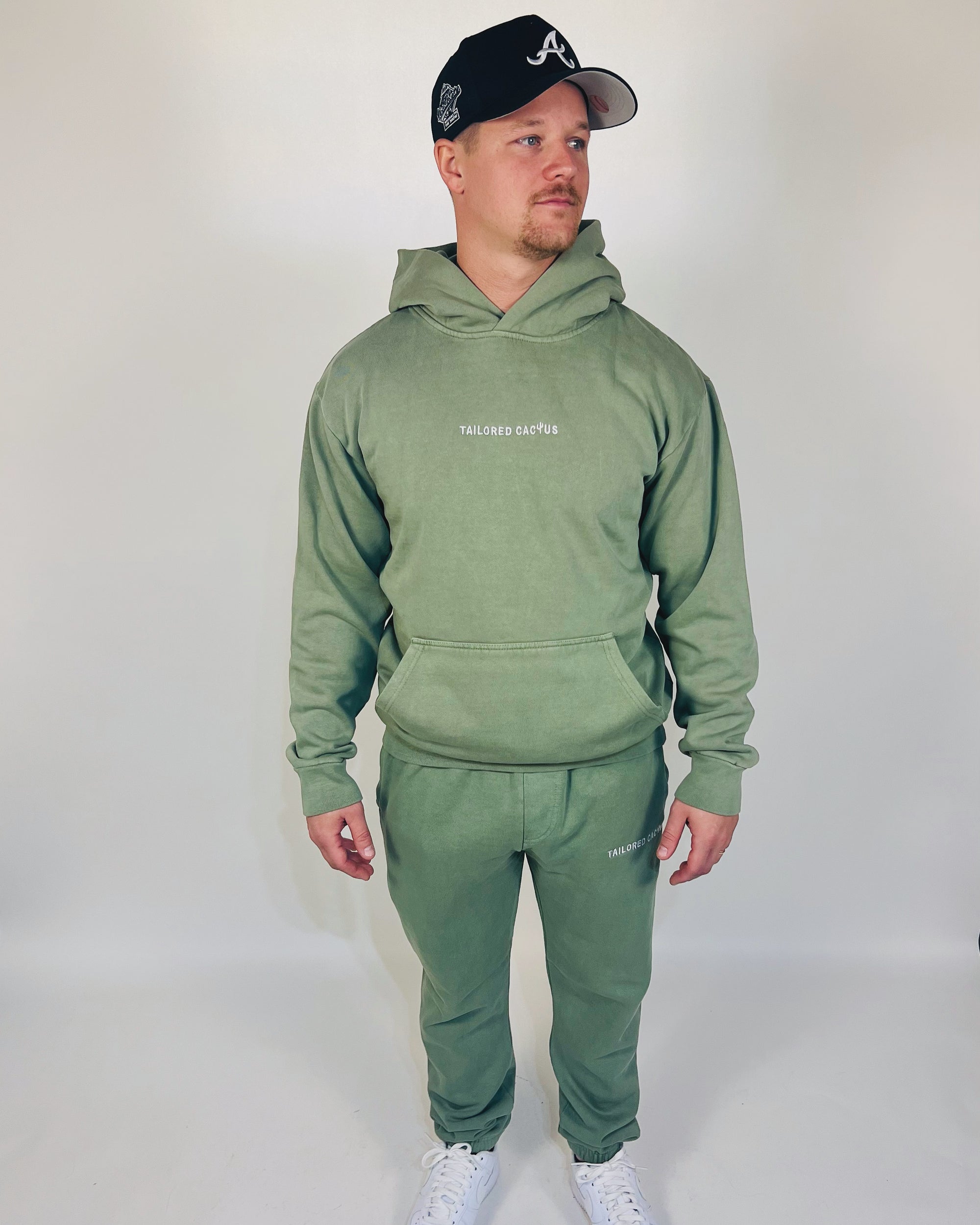 Man in tailored cactus green hoodie