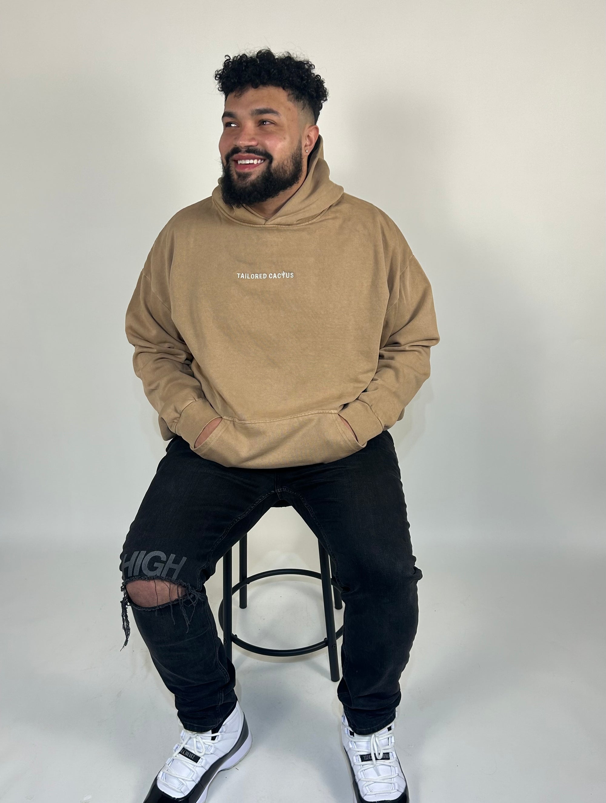 Man in tan tailored cactus hoodie 