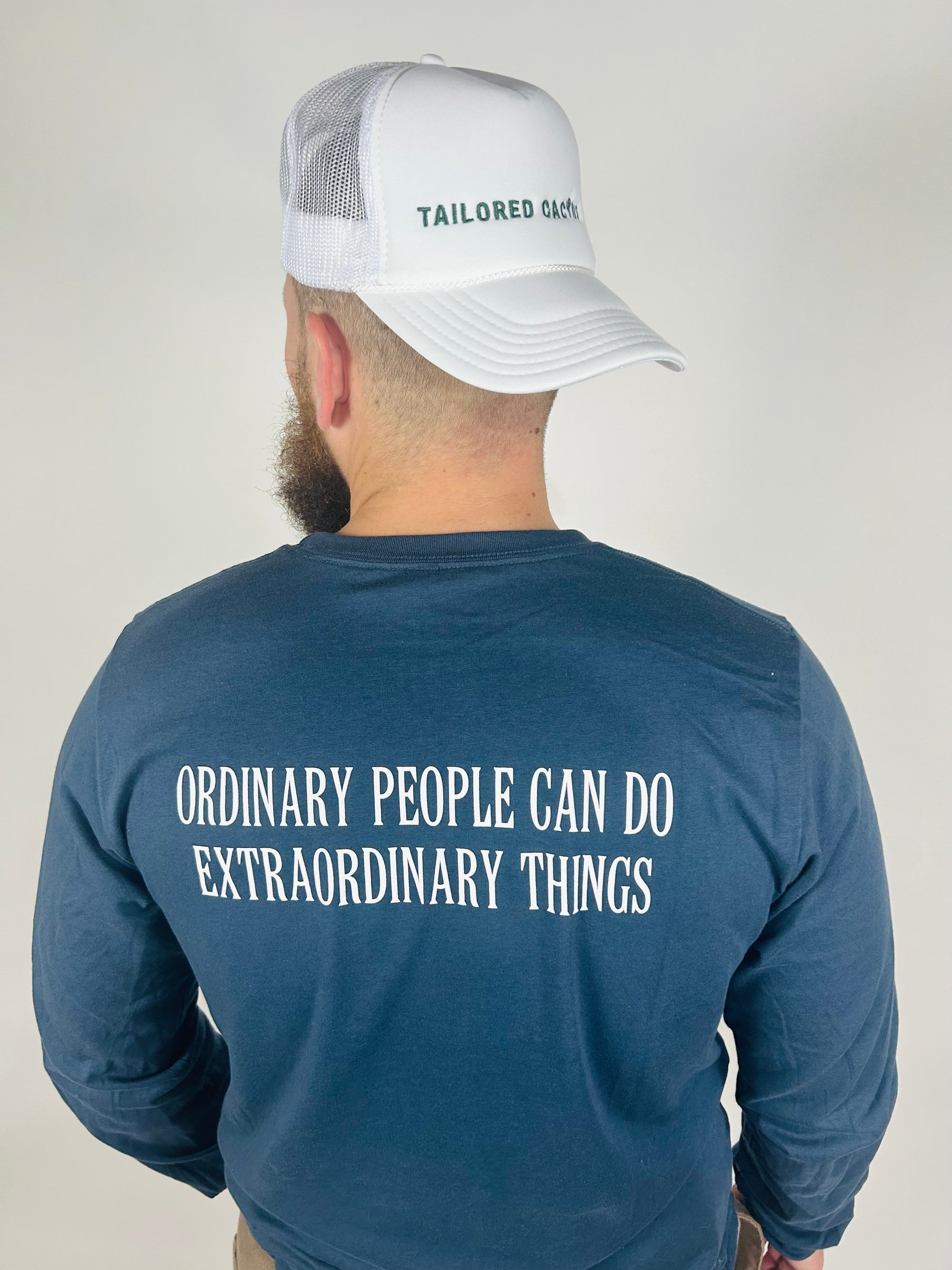 Man in white tailored cactus trucker hat 