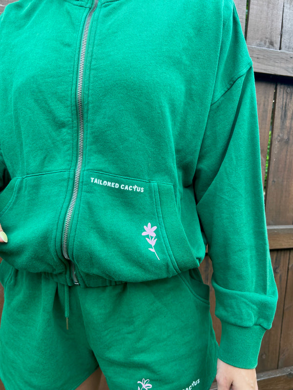 irl in tailored cactus green matching sweat shorts and jacket with pink flowers