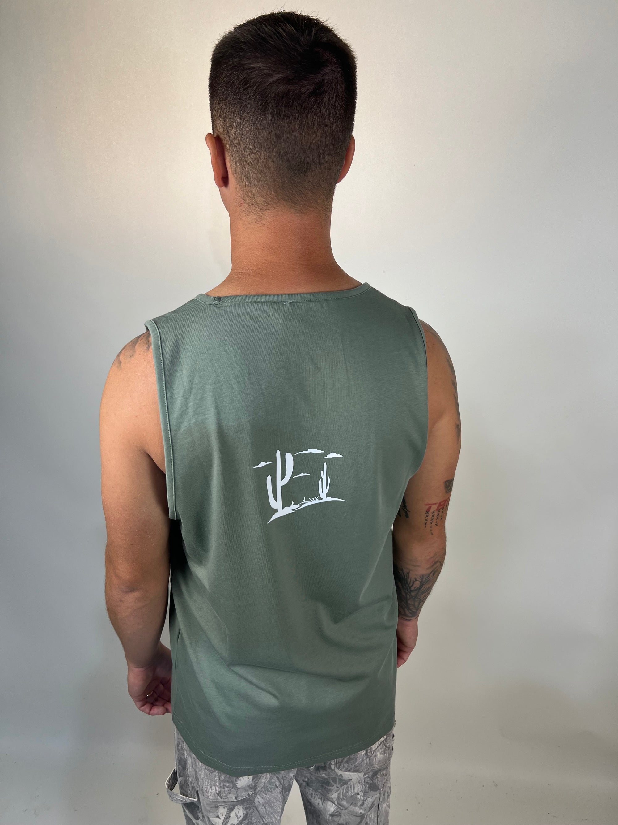 Man in tailored cactus green tank top