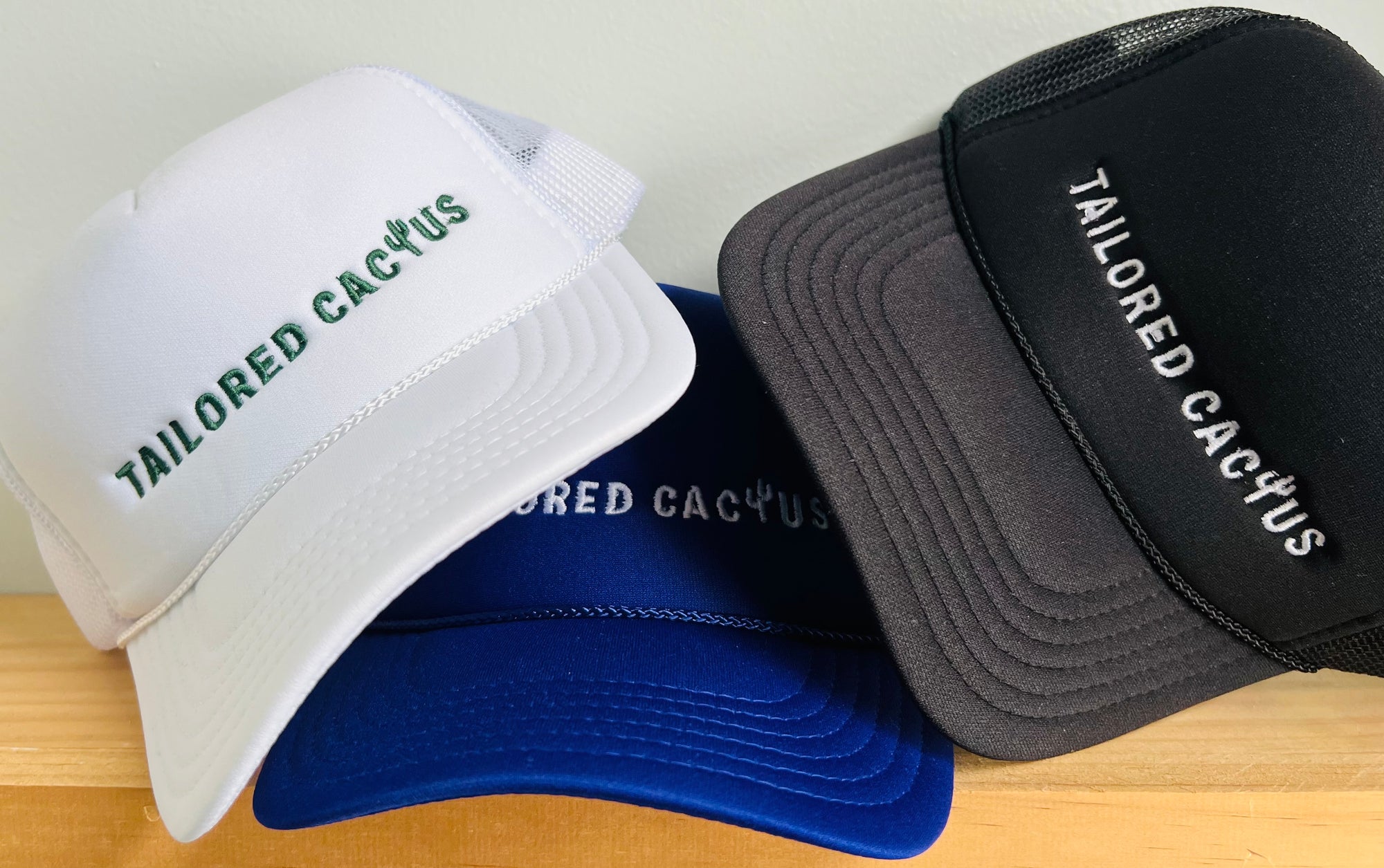 Group of tailored cactus trucker hats 