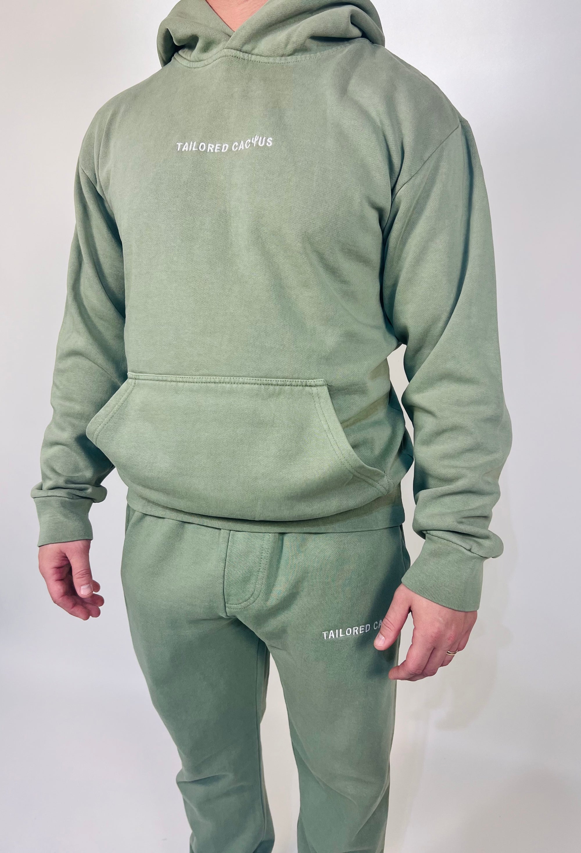 Man in tailored cactus sweat set 