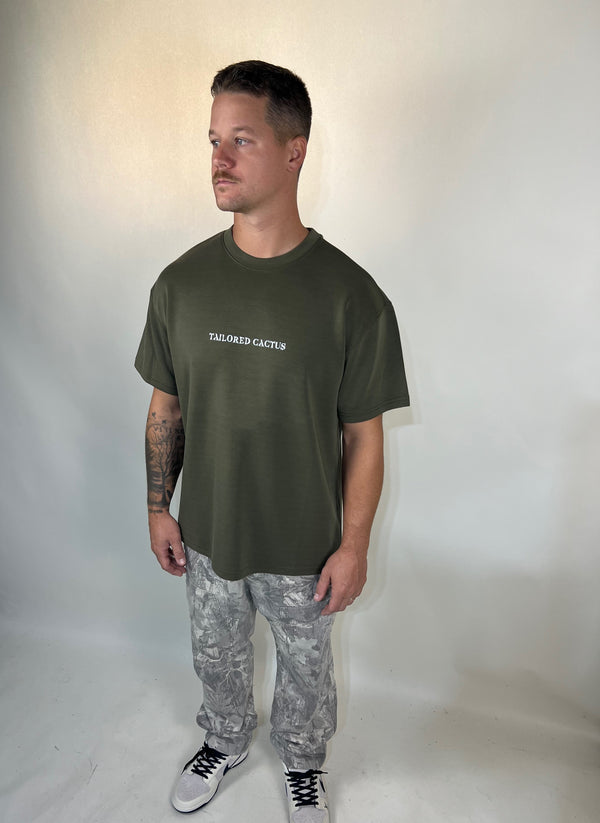 Man in tailored cactus army green T shirt 