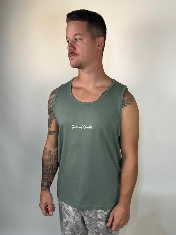 Man in tailored cactus green tank top