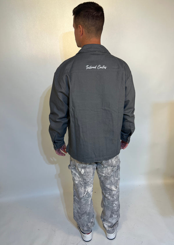 Man in grey ’powered by faith’ tailored cactus cargo jacket