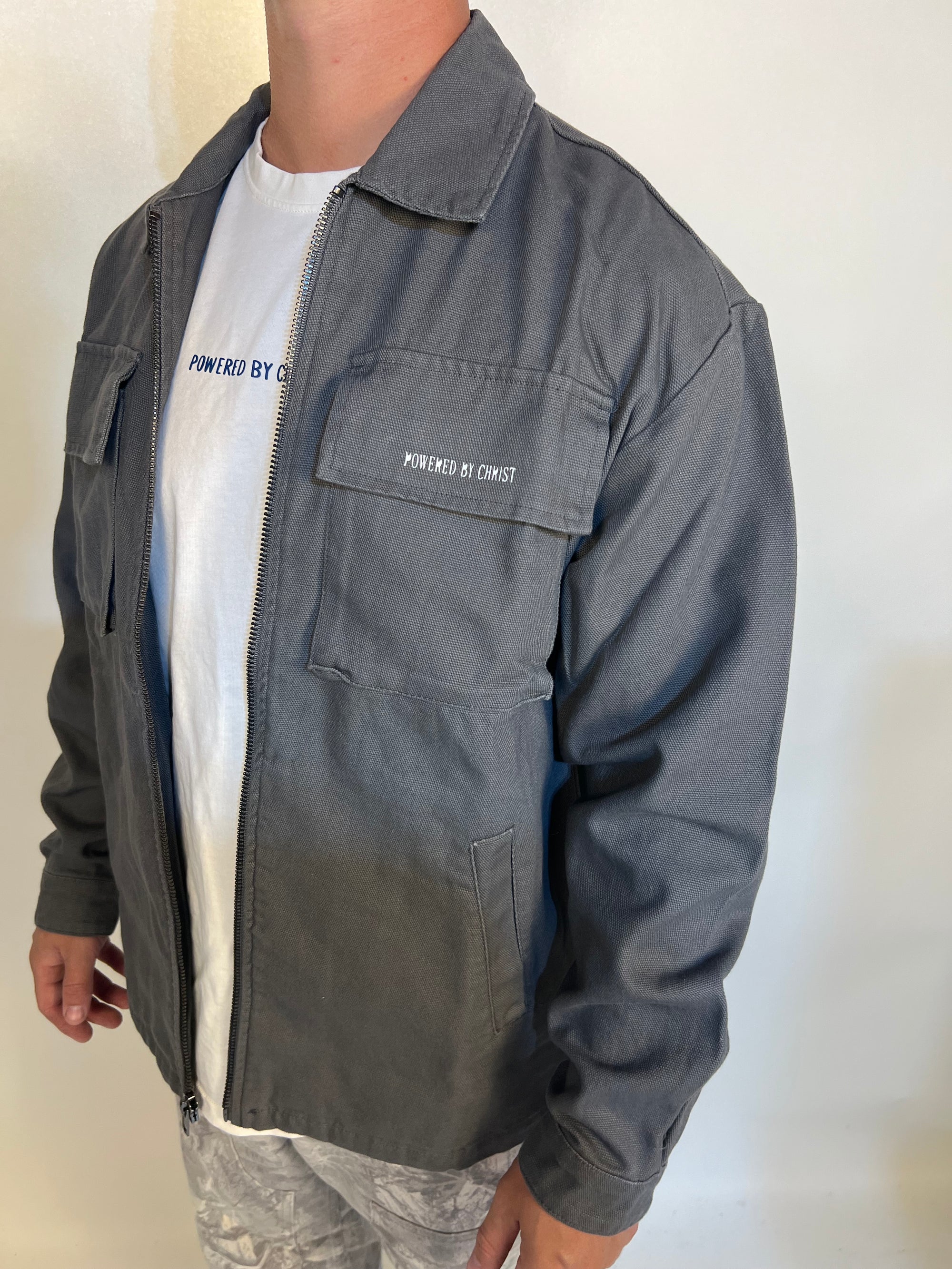 Man in grey ’powered by faith’ tailored cactus cargo jacket