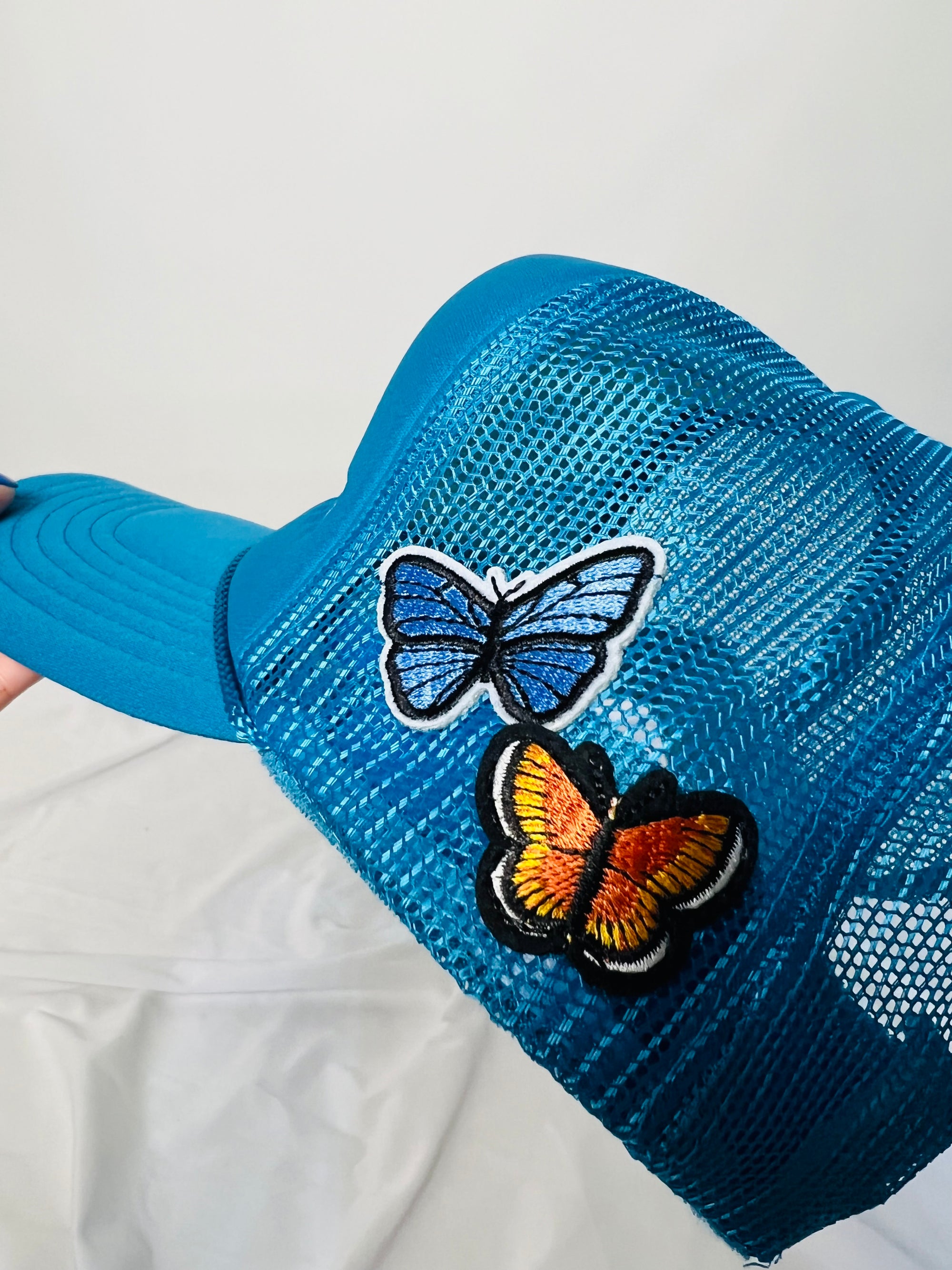 Tailored cactus blue butterfly trucker hat 