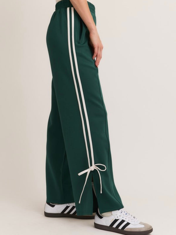 Tailored cactus girl in green pants with white bow
