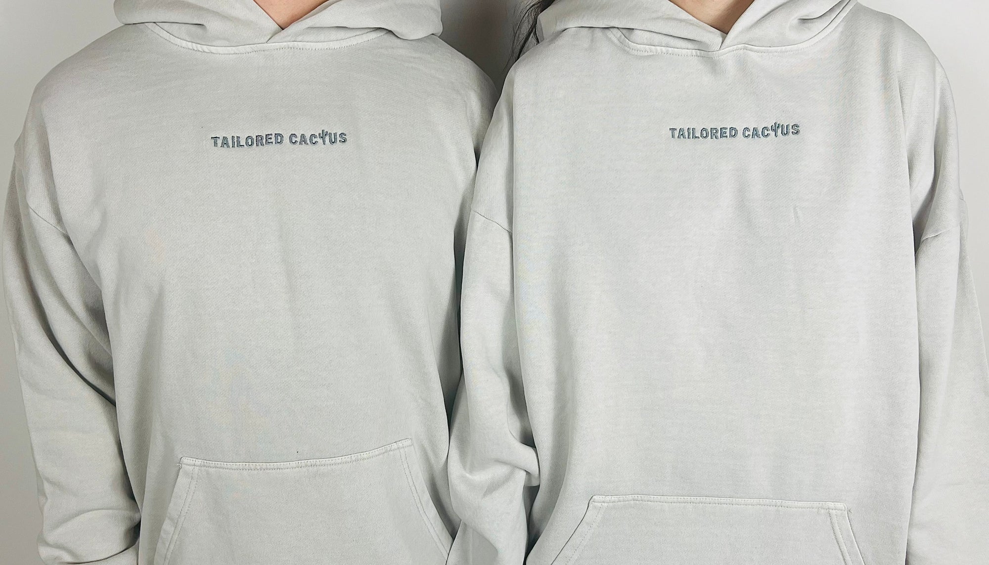 front of man and woman in tailored cactus hoodie