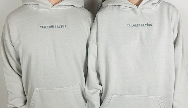 front of man and woman in tailored cactus hoodie